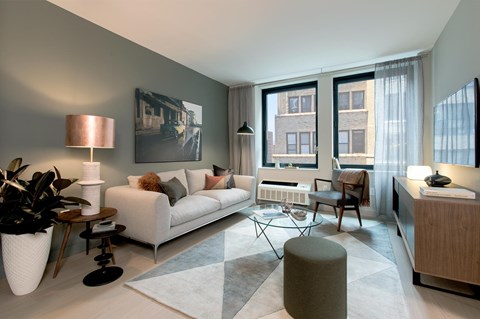 a living room with a couch and a table